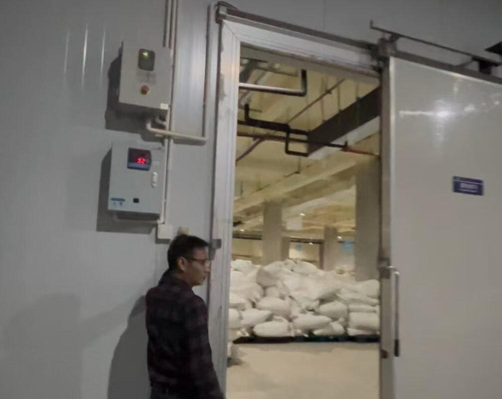 Insulated cold room entrance and temperature control panel at the tea storage facility